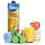 Two green dumbells, tape measure and healthy food. Fitness and h